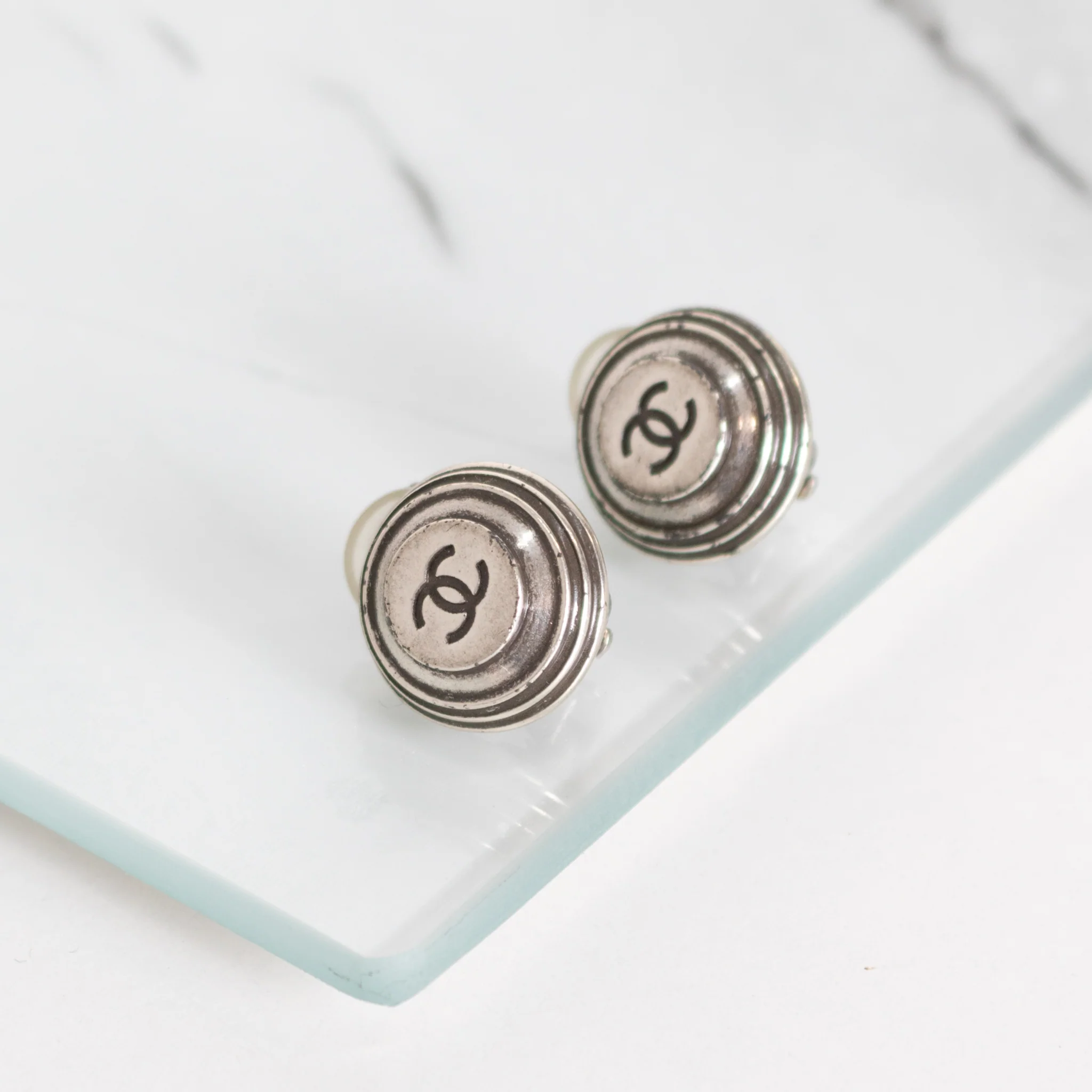 Chanel Silver CC Round Clip On Earrings - Image 2
