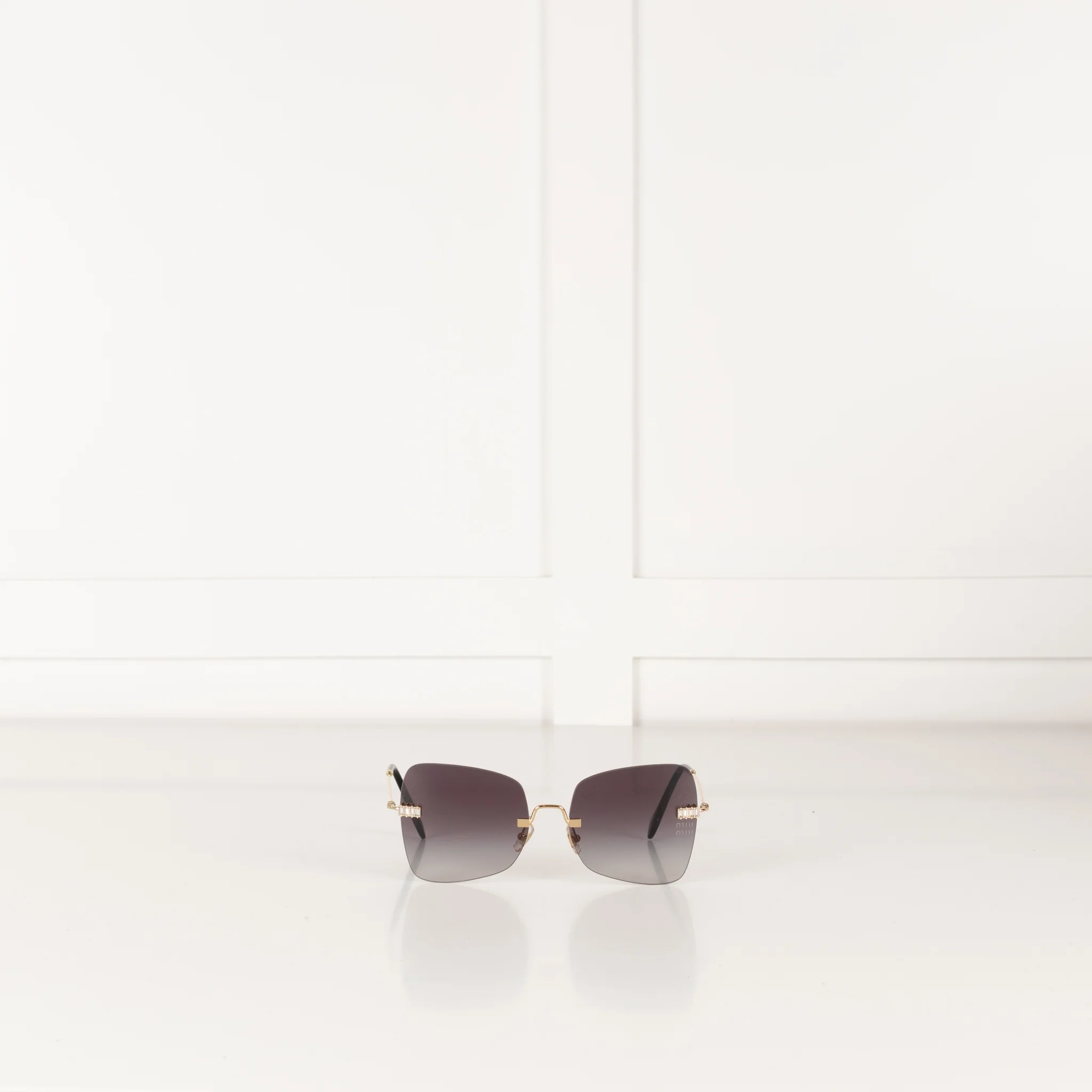 Miu Miu Sunglasses With Gold and Black Arms And Crystal Embellishsments