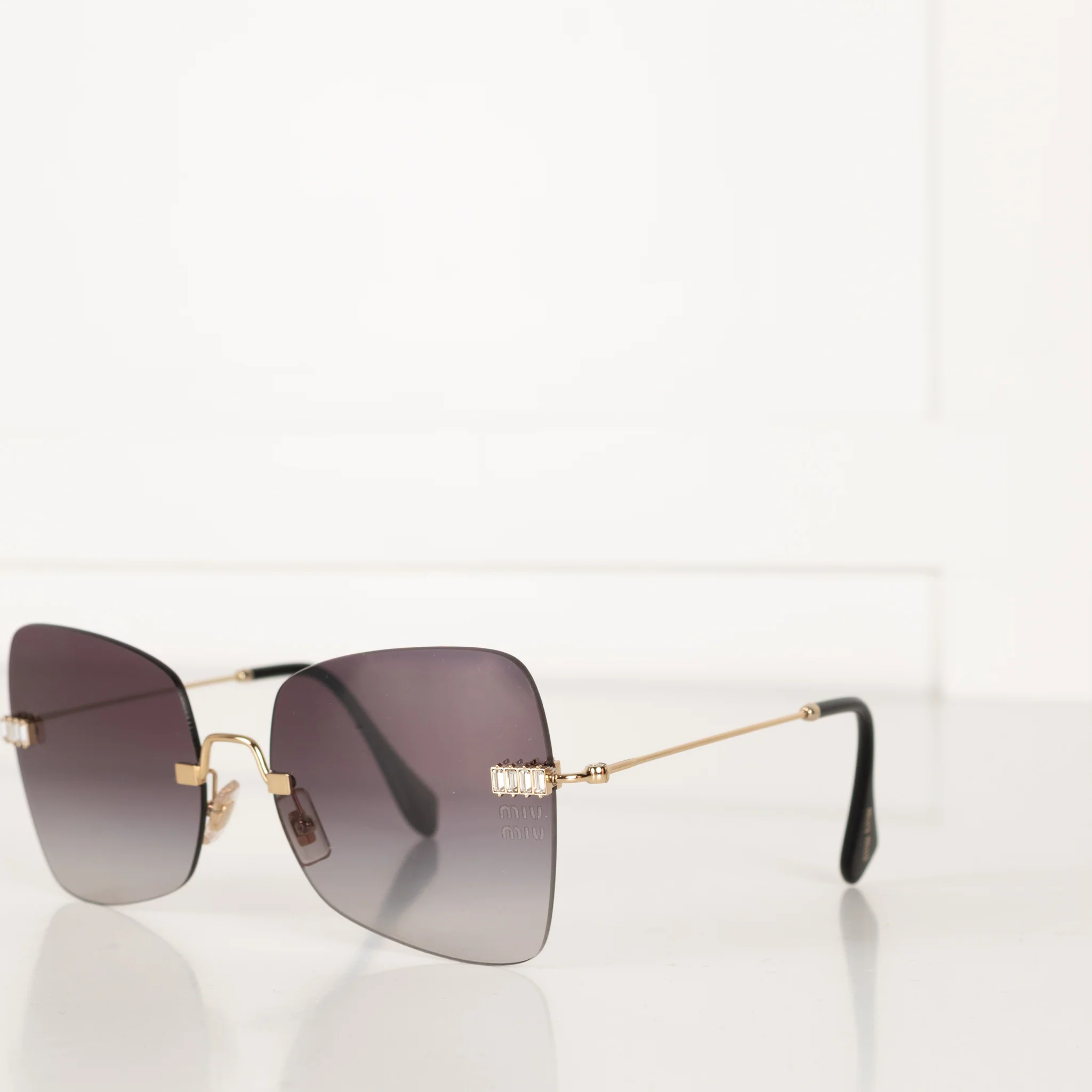 Miu Miu Sunglasses With Gold and Black Arms And Crystal Embellishsments - Image 8
